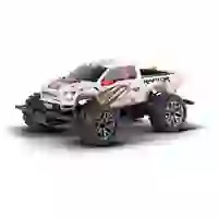 Ein ferngesteuertes Truck-Spielzeug im Offroad-Stil mit großen, groben Reifen und einer weißen Karosserie mit orange-schwarzen Grafiken.